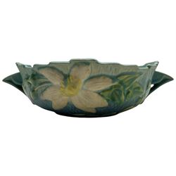Roseville pottery twin handled bowl, decorated with clematis on a blue ground, marked ‘Roseville USA 457-8’ to the base
