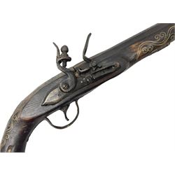 Reproduction flintlock pistol, the full walnut stock with brass filigree inlay and mounts and skull crusher butt L46cm; no visible proof marks FIREARMS CERTIFICATE REQUIRED OR RFD