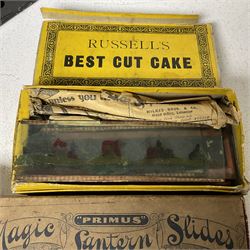Tinplate magic lantern with three boxes and some loose slides, including Primus magic lantern slides