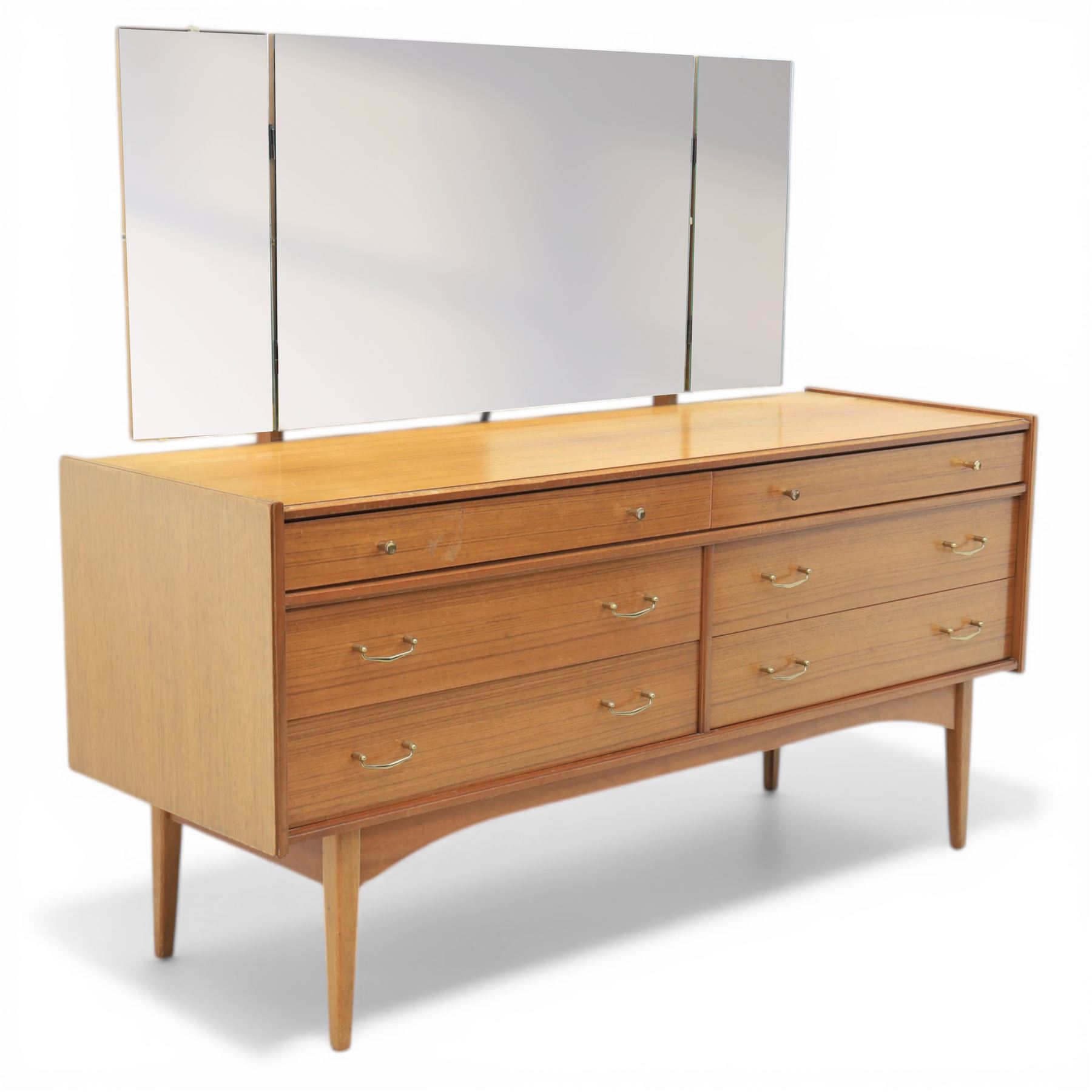 Golden Key By Palatial Ltd - mid-20th century teak dresser, three part mirror above a rectangular top, with six drawers with brass handles and pulls, upon splayed tapering legs 