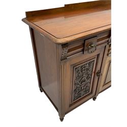 Late 19th century walnut sideboard, fitted with four drawers and four cupboards, carved detail