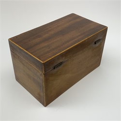 An early 19th century Regency style mahogany trinket box, of sarcophagus form with scroll ends and raised upon compressed bun feet, the lift off cover with traces of needle work, L17cm, together with a Georgian mahogany and strung tea caddy, of rectangular form with bone escutcheon, L20.5cm. 