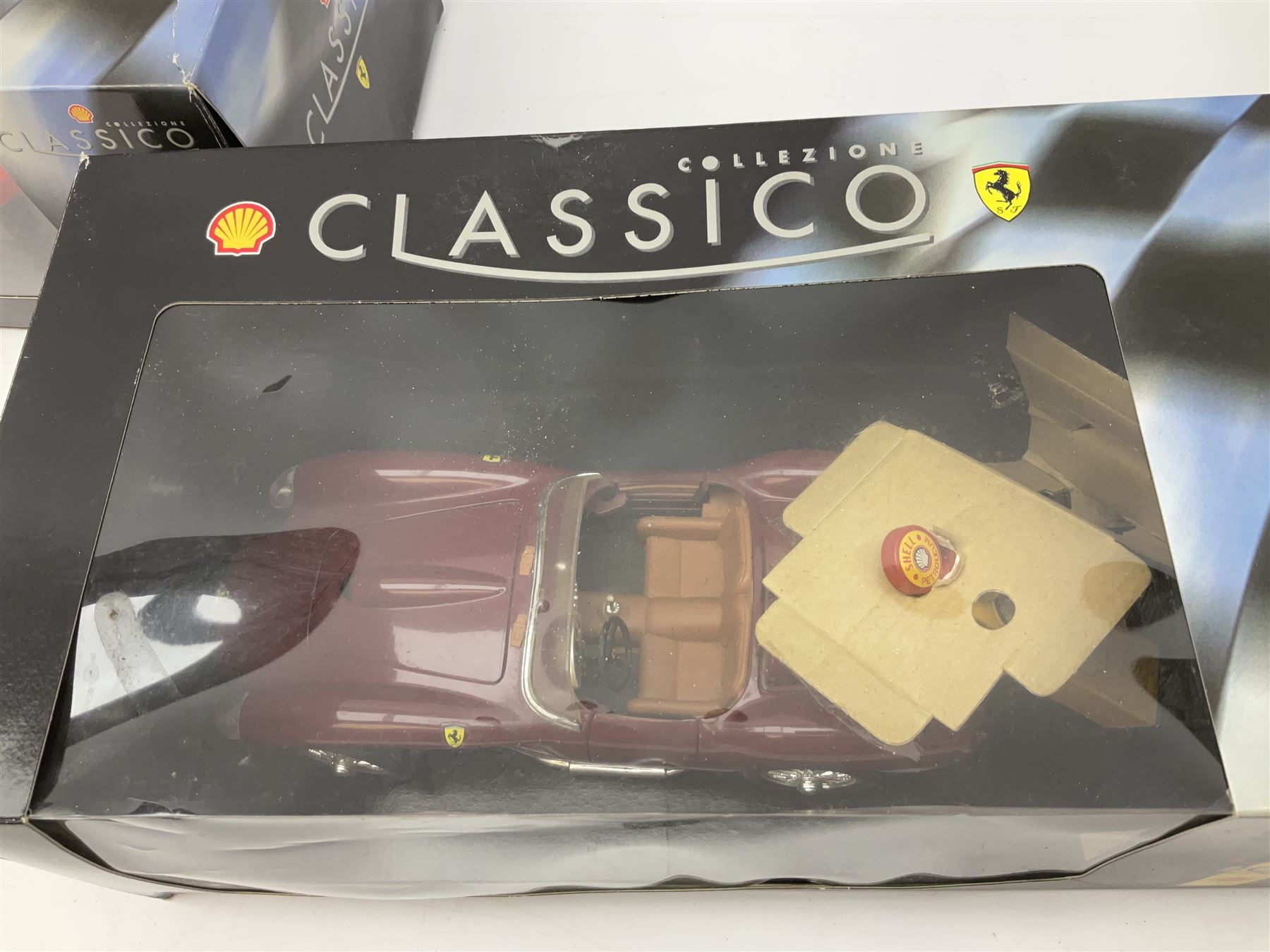Two Collezione Classico large scale die-cast models of a Ferrari 1972 312P with Racing Fuel Pump and Ferrari 1958 250 Testa Rossa with Road Fuel Pump; and two Minichamps 1:18 scale models of a McLaren Mercedes Racing Car and Auto Union Typ C racing car; all boxed (4)