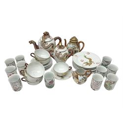 Japanese Kutani China tea service, comprising two teapots, six teacups and saucers and six side plates, the teapot handles and finials decorated in relief with dragons, the bodies decorated with gilt dragon decoration, together with other Japanese ceramics
