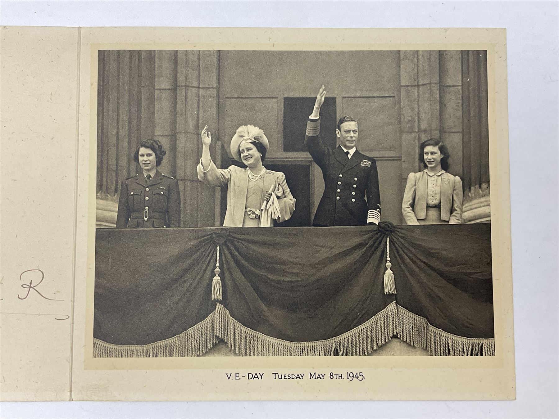 King George VI and Queen Elizabeth - signed 1945 Christmas card with gilt embossed crown to cover, black and white photograph to the interior, of The Royal Family waving from the balcony of Buckingham Palace, on V-E Day Tuesday May 8th 1945, signed 'George R.I. Elizabeth R.'