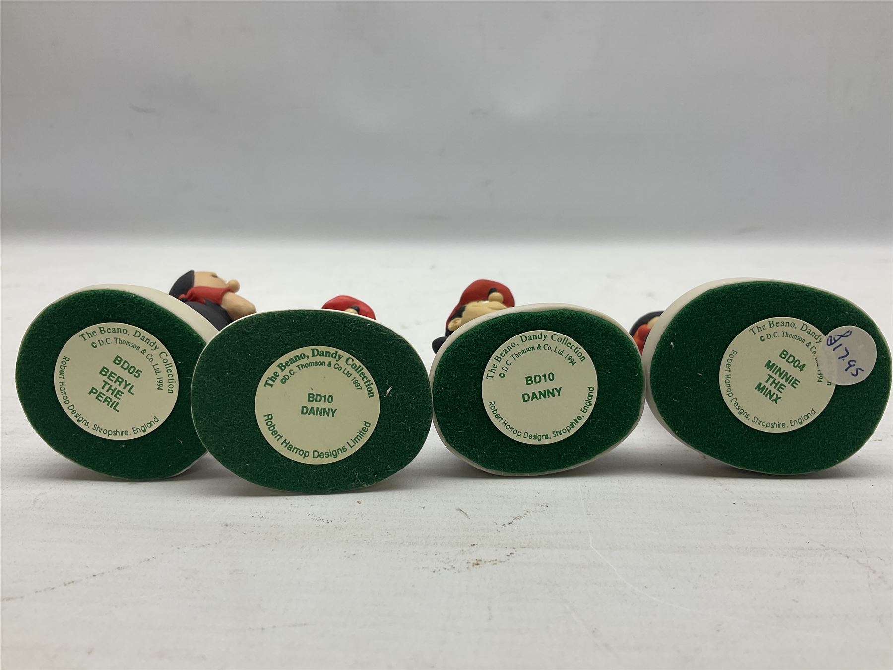 Fourteen Robert Harrop figures from the Beano Dandy collection, comprising Minnie the Minx BD04, Danny BD10, Biffo the Bear BD19, Spotty BD16, Smiffy BD09, Oops! BDS01, Little Plum BD27, Wilfrid BD15, Danny BD10, Winston BD17, 'Erbert BD14, Gnasher BD02, Beryl the Peril BD05 and Desperate Dan BD03, all with boxes