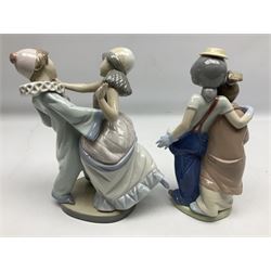 Two Lladro figures, comprising Masquerade Ball no 5452 and Pals Forever no 7686, together with Lladro Art Brings Us Together plaque, all in original boxes, largest example H23cm