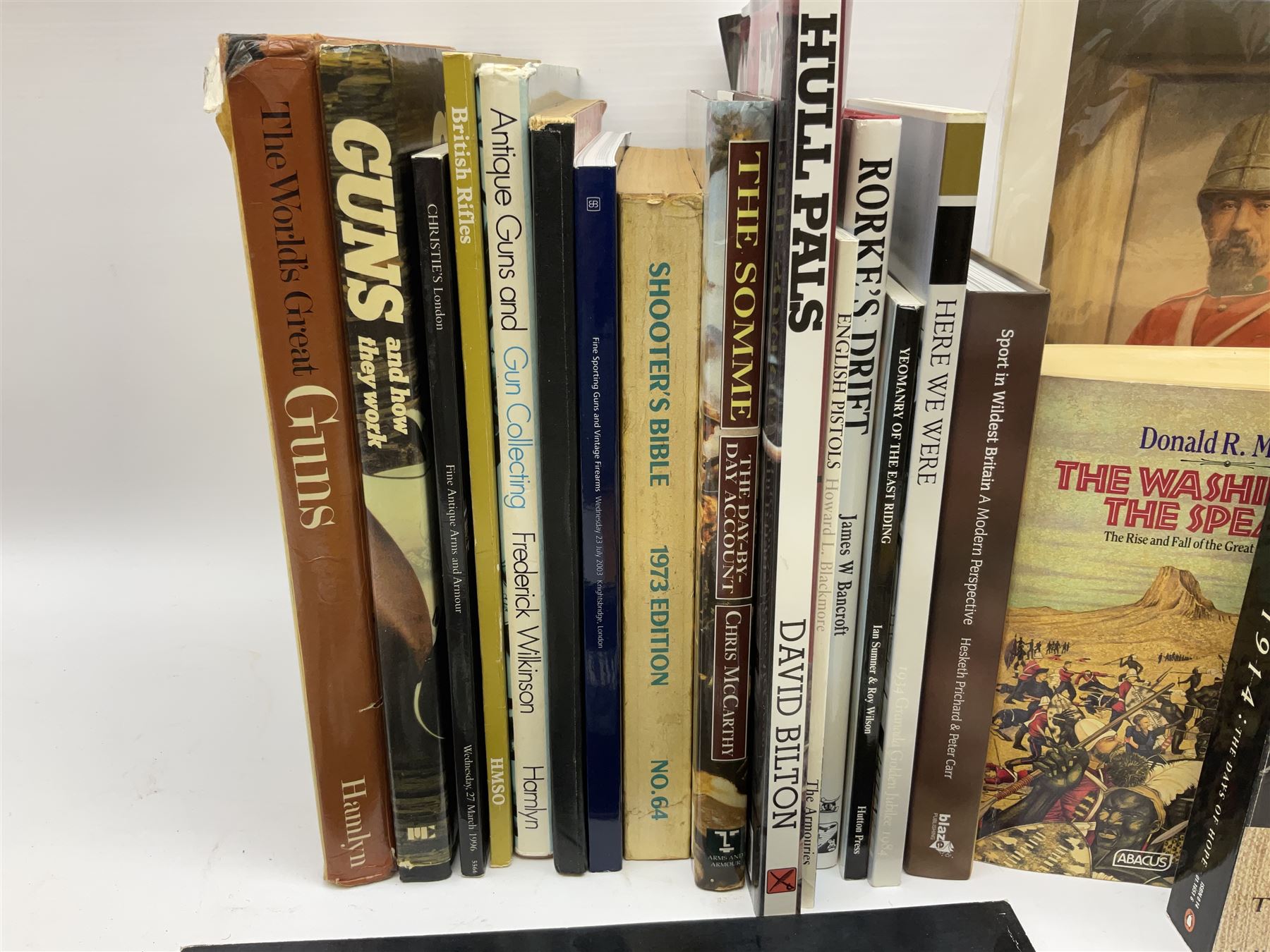 Sixteen books/booklets on guns and shooting including 1969 Holland & Holland Catalogue; two Gunmark Guides to Good Shooting; Shooters Bible 1972 etc; and small quantity of militaria books