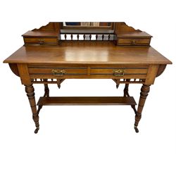 Late Victorian Aesthetic Movement walnut and inlaid ebony dressing table, swing mirror back with shell carving and spindle support rail, fitted with two trinket drawers and single frieze drawer, raised on ring turned supports with castors