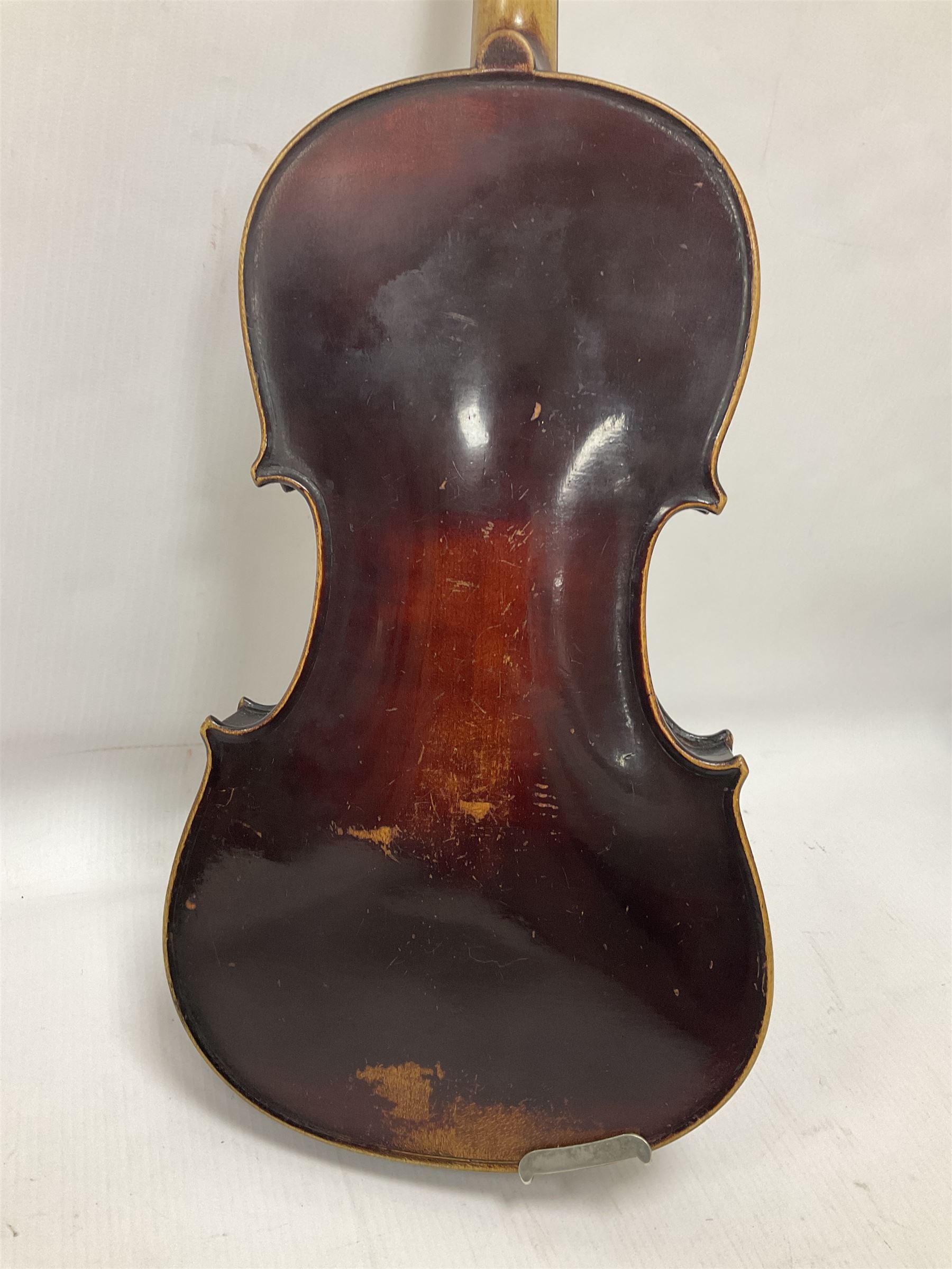 Neuner & Hornstiner early 20th century half size violin c1900, two piece maple back and ribs with a spruce top in a later ridged carrying case, no bow Length 57cm