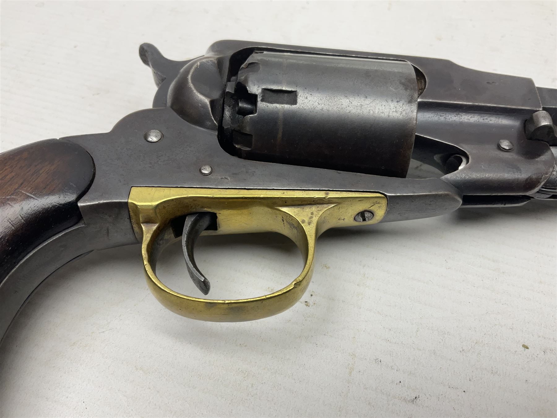 Unmarked Spencer & Rogers type Remington style .44 cal. six-shot percussion revolver, 20cm octagonal barrel with loading lever under, brass trigger guard and two-piece wooden grip L37cm overall; together with a framed watercolour by Alan J. Gray dated 2009 entitled 'The Remington .44 Calibre 1861 Navy Revolver'  19 x 42cm (2)