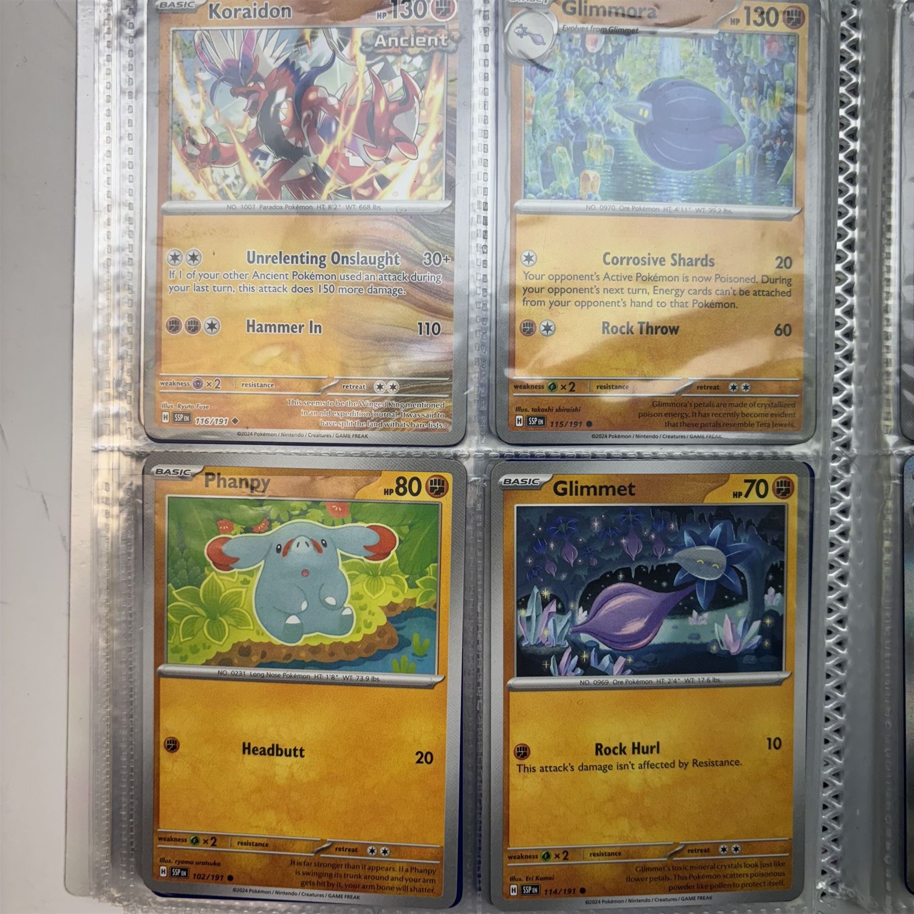 Collection of modern Pokemon TCG trading cards from the Scarlet & Violet and Sword & Shield eras, contained within in two folders, opened packets and loose, together with a graded Sword & Shield Silver Tempest Passiman TG08, GET Graded 9 Mint, two oversized cards, energy cards, vintage booklets and boxes, empty tins, 1998 Electronic Pokédex and other accessories