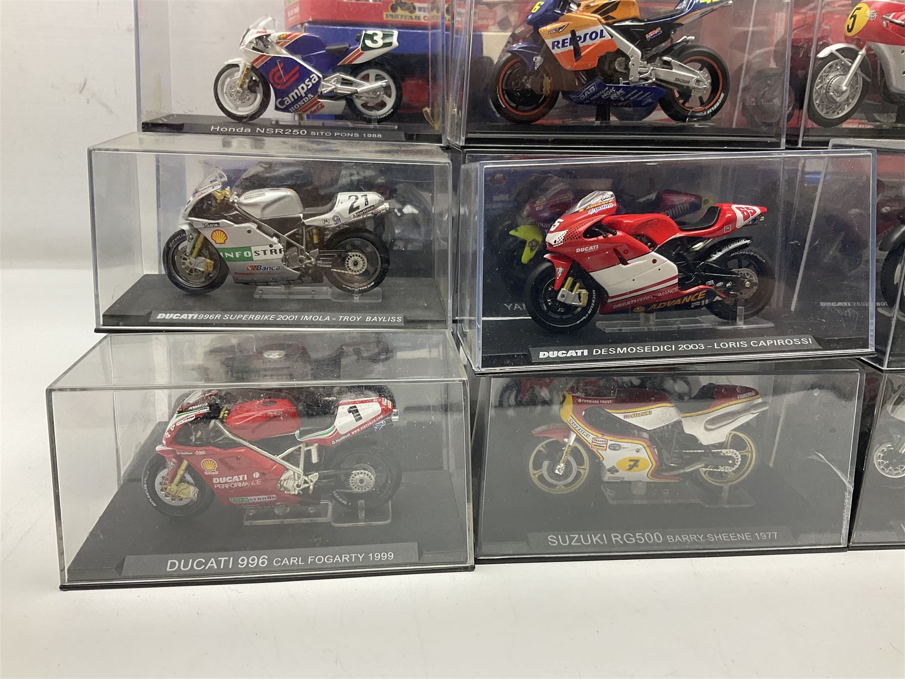 Fifty-one die-cast models of motorcycles by Maisto, Protar Italeri, Welly etc; many in perspex display boxes, some in window boxes and some unboxed