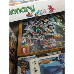 Collection of Lego Games sets, including no. 3841 Minotaurus, 3862 Harry Potter Hogwarts, 50011 Lord of the Rings Battle of Helms Deep, 3860 Heroica Fortaan, 3848 Pirate Plank, 3855 Ramses Return, 3844 Creationary, etc