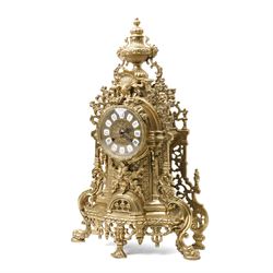 19th century design mantel clock, the brass dial with porcelain numerals, bell strike in brass case of rococo design with urn finial H60cm
