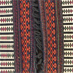 Persian Turkoman double saddlebag, north eastern region, with horizontal bands of multicoloured diamond motifs on a cream field, geometric border bands in red and black, joined with woven and wrapped centre panel