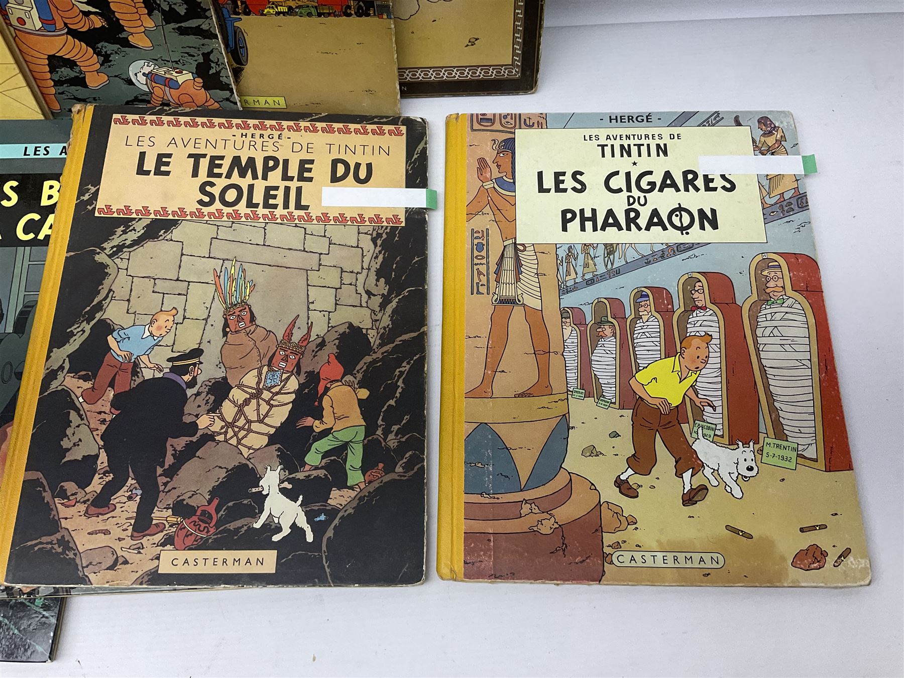Twenty one first edition Herge, 'The Adventures of Tin Tin' books published by Casterman Bruxelles, with French text and coloured comic strip illustrations throughout; comprising Tintin Au Congo 1946, Tintin En Amerique 1946, Les Cigares du Pharaon 1955, Le Lotus Bleu 1946, L'Oreille Cassee 1943, L'ile Noire 1943, Le Sceptre d O'ttokar 1947, Le Crabe Aux Pinces D'or 1943, L'Etoile Mysterieuse 1942, Le Secret de la Licorne 1943, Le Tresors de Rackan Le Rouge 1945, Les 7 Boules de Cristal 1948, Le Temple du Soleil 1949, Au Pays de L'Or Noir 1950, Objectif Lune 1953, On a Marche sur la Lune 1954, L'Affaire Tournesol 1956, Coke en Stock 1958, Tintin au Tibet 1960, Les Bijous de la Castafiore 1963 and Vol 714 Pour Sydney 1968
