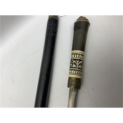 Early 20th century Indian ebonised sword stick, the 59.5cm blade with punched decoration and horn grip L94cm overall; and a reproduction Indian tulwar with scabbard (2)