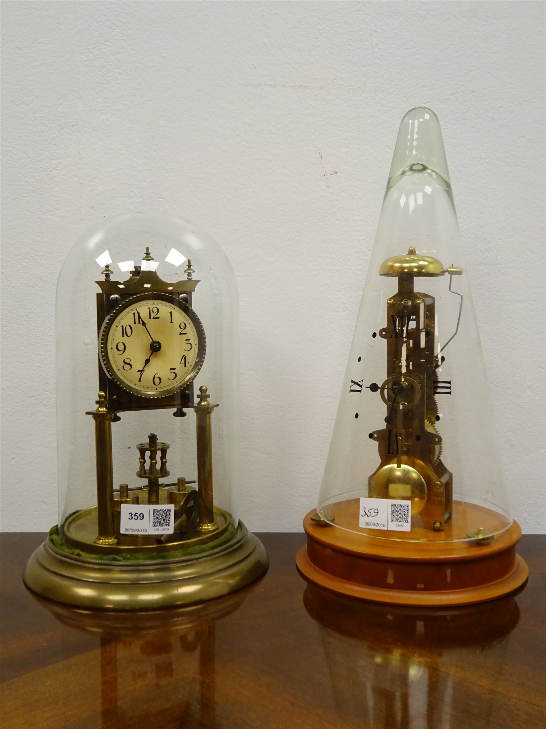 Franz Hermle German skeleton clock, numerals painted on conical glass dome, striking on a bell