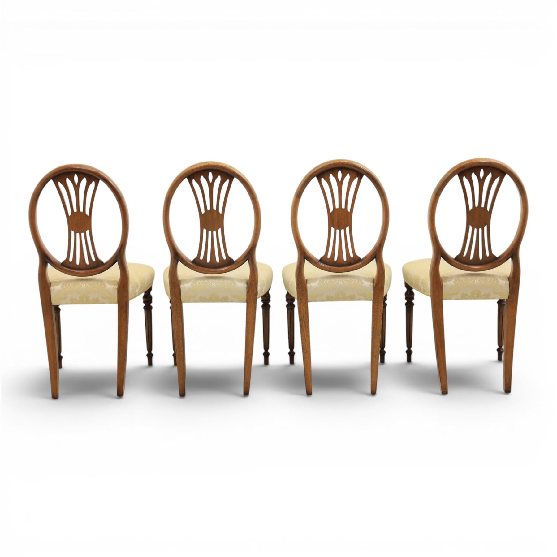 Bevan Funnell Reprodux - Regency design set of ten mahogany dining chairs, oval backs with central splat with rose motif, serpentine seat upholstered in damask fabric, raised on turned supports