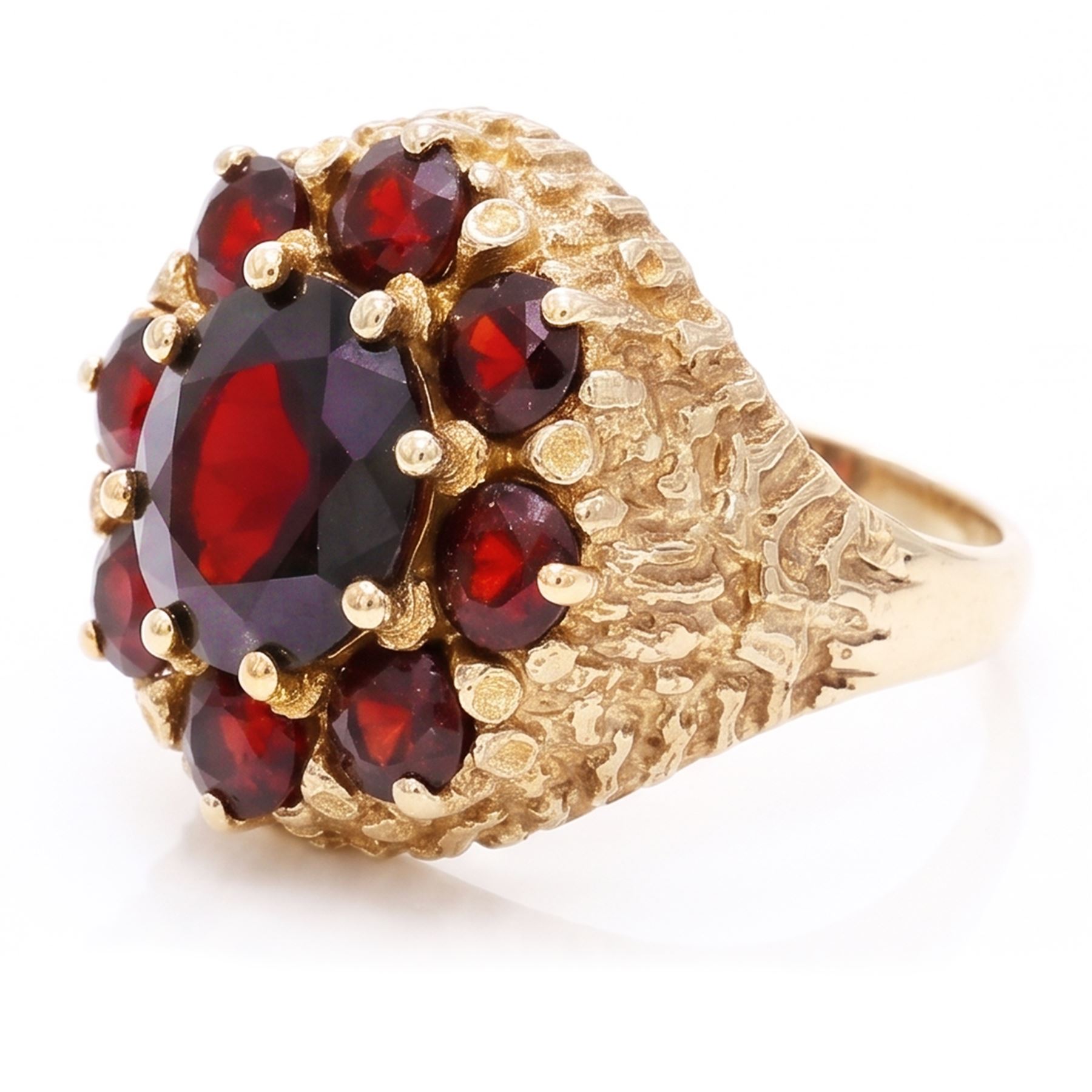 9ct gold garnet cluster ring, set with nine round cut garnets, with textured gallery and shoulders, hallmarked
