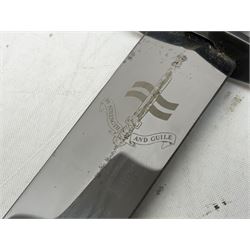 Gulf War period commando knife with 17cm double-edged steel blade etched with the crest and motto 'By Strength and Guile', blackened cross-piece and grip; in webbing scabbard L31cm overall