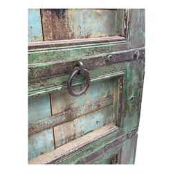 Pair of green-painted Indian doors, c.1860–1880, made from solid teak featuring original iron work and hand-painted finish