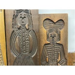 Six 20th century hardwood Dutch folk art Speculaasplank or biscuit moulds, typically carved with figures in traditional dress, largest H101cm