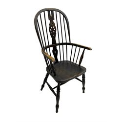 19th century stained elm and beech Windsor chair, high hoop and stick back with pierced wheel splat over shaped saddle seat, raised on ring turned supports united by H-stretcher