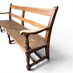 Early 20th century pine and oak bench seat, stained pine rail back frame with shaped oak arms