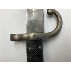 Turkish Model 1874 sword bayonet with 57.5cm curving steel fullered blade and chequered black grip, in steel mounted leather scabbard L75.5cm overall