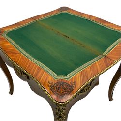 20th century French walnut and Kingwood card table, shaped fold-over top with figured quarter-matched veneers and floral egg and dart moulded edge in gilt metal, shaped aprons decorated with shell motifs with extending foliage, pull-out action base revealing storage well, on cabriole supports with ornate gilt metal mounts 