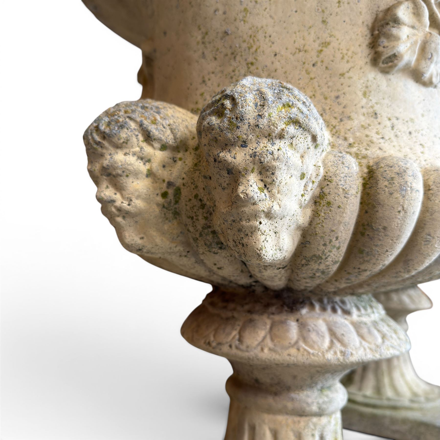 Pair of large cast stone garden urns, circular form with egg and dart border, tapering gadrooned bowl with cast handles and detail