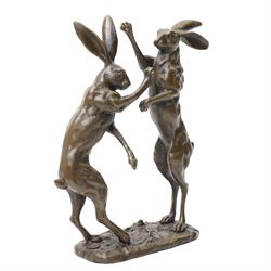 Bronze figure group, modelled as two male hares boxing, upon a naturalistic base, with foundry mark, H27cm