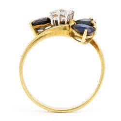 18ct gold sapphire and diamond crossover ring, four round brilliant cut diamonds, each finial set with two pear cut sapphires, London 1978