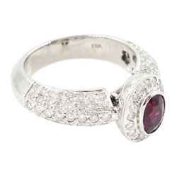 18ct white gold oval cut ruby and round brilliant cut diamond cluster ring, with pave set diamond shoulders, stamped 750, ruby approx 1.05 carat, total diamond weight approx 1.00 carat
