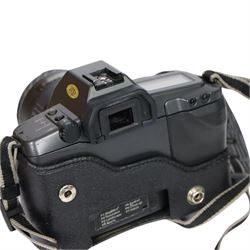 Three 35mm film SLR cameras, comprising Canon EOS 50E camera body with a Canon Ultrasonic EF 28-80mm 1:3.5-5.6 lens, together with a Canon EOS 600 camera body with a Sigma UC 28-70mm 1:3.5-4.5 lens and a Praktica MTL5 with a Carl Zeiss Jena DDR MC Flektogon 2.4/35 lens