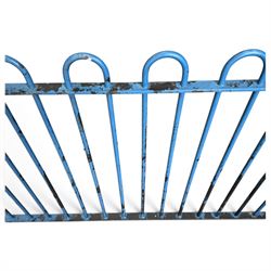 Two sections of painted iron garden or estate boundary railing, comprising a 19th century wrought iron section with graduated spearhead uprights, together with a later hoop-top section with ball-finial end posts, both in blue painted finish