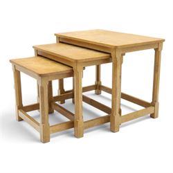 Mouseman - nest of three oak occasional tables, rectangular adzed top, on octagonal supports united by plain stretchers, each carved with mouse signature, by the workshop of Robert Thompson of Kilburn