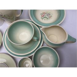 Susie Cooper Dresden Sprays pattern breakfast set, including coffee pot, sugar bowl, milk jug, egg cup, teacup trio and bowl, together with a Susie Cooper Wild Rose pattern coffee service for six