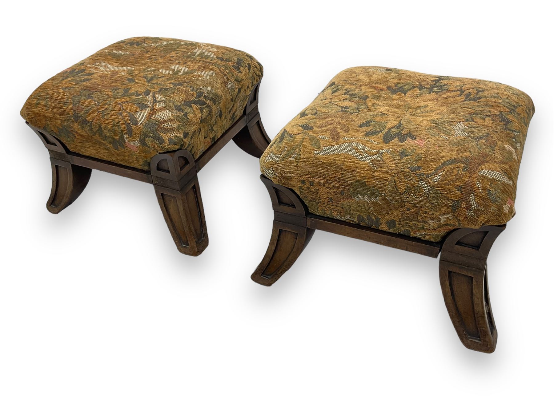 Pair of early 20th century miniature footstools, square seat covered in gold and orange floral patterned tapestry fabric, on carved wooden frame with splayed supports 