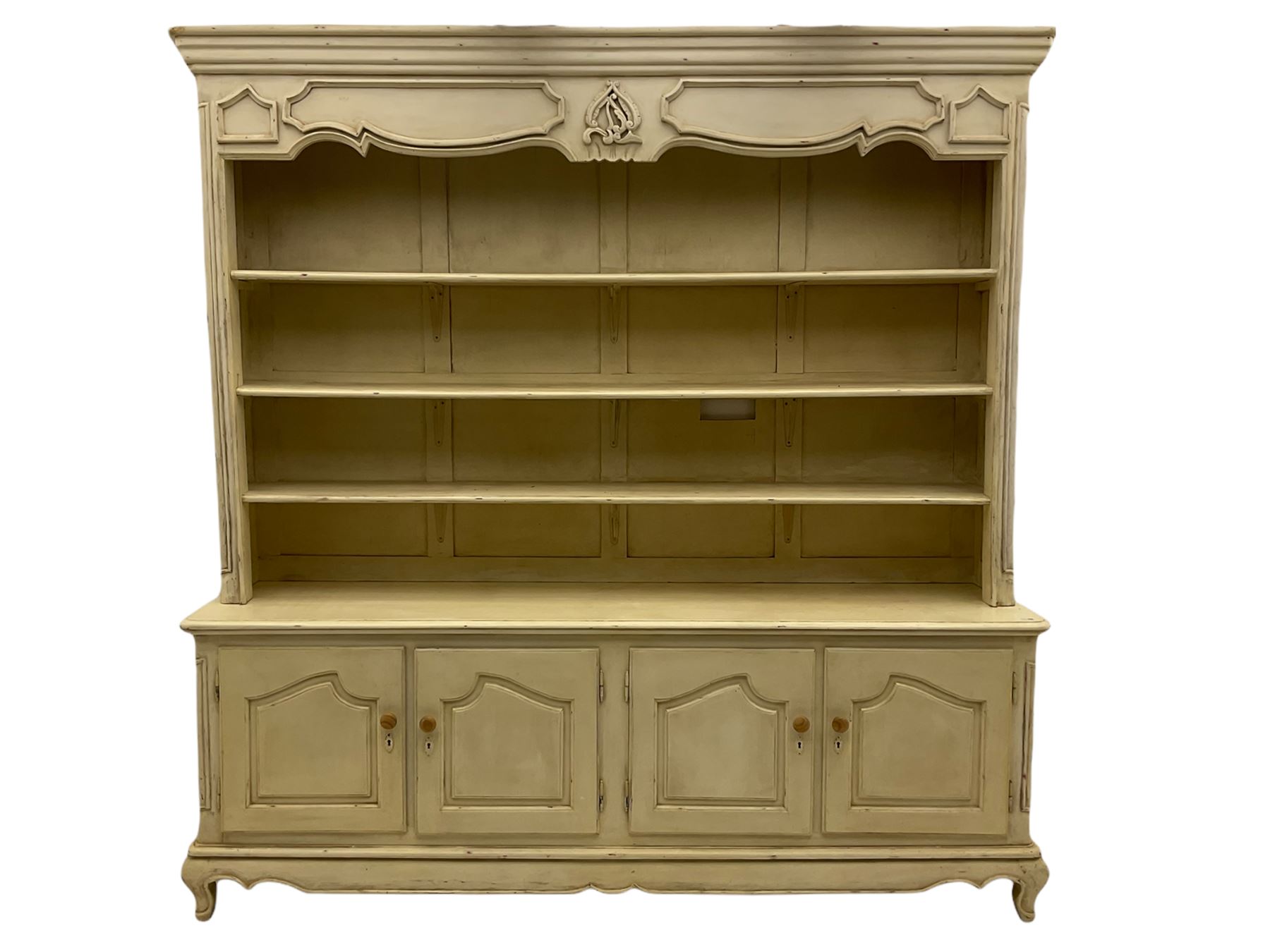 Large French style cream painted dresser, fitted with four cupboards and three tier plate rack