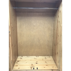  Pine double wardrobe, two doors above two drawers, bun feet (W94cm, H190cm, D57cm) and matching kneehole dressing table, six drawers, bun feet (W143cm, H78cm, D46cm) (2)  