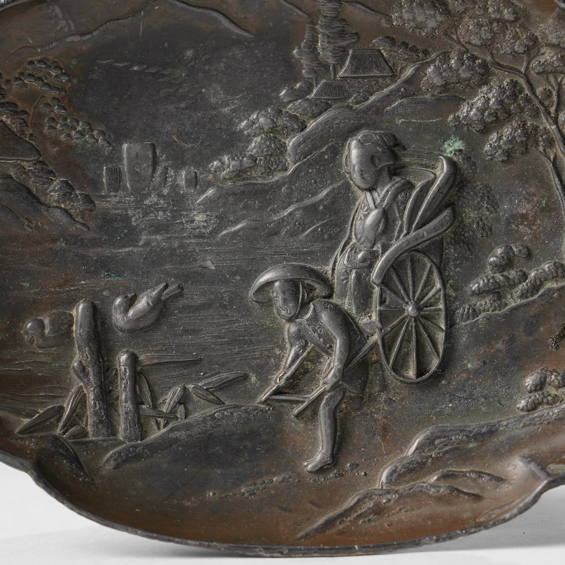 Japanese bronze tray, decorated in relief with two travellers in a landscape, W15cm 
