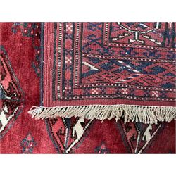 Turkman Bokhara rug, red ground field decorated with repeating Gul motifs