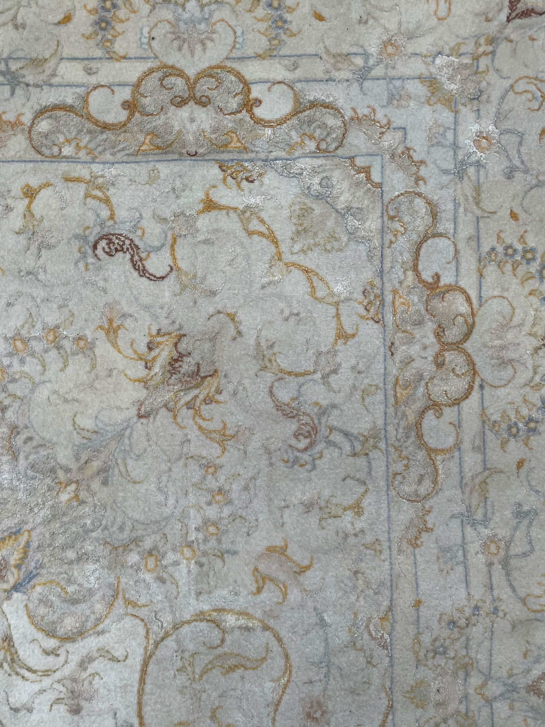 Persian Mahal densely knotted ivory ground carpet, floral rosette medallion surrounded by interlacing leafy branches and palmettes, scrolling border decorated with foliate motifs, within guard stripes, with signature panels to each end