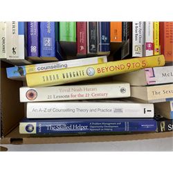 Group of books, mostly self help and psychology related in one box