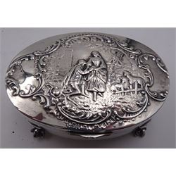 Group of silver, to include Edwardian silver mounted jewellery box, of oval form, the cover repousse decorated with Dutch romantic scene, opening to reveal a gilded and blue velvet interior, upon four claw feet, hallmarked William Comyns & Sons, London 1902, together with a Victorian silver coffee cup holder, hallmarked Sampson Mordan & Co, London 1899, early 20th century silver purse, hallmarked John Rose, probably Birmingham 1915, assay office mark worn and indistinct, 1920s silver mustard pot and cover,  hallmarked William Hutton & Sons Ltd, Birmingham 1923, Edwardian silver napkin ring, hallmarked Arthur Cook, Birmingham 1903 and a silver thimble, hallmarked Claydon, Robin & Co, Chester 1910