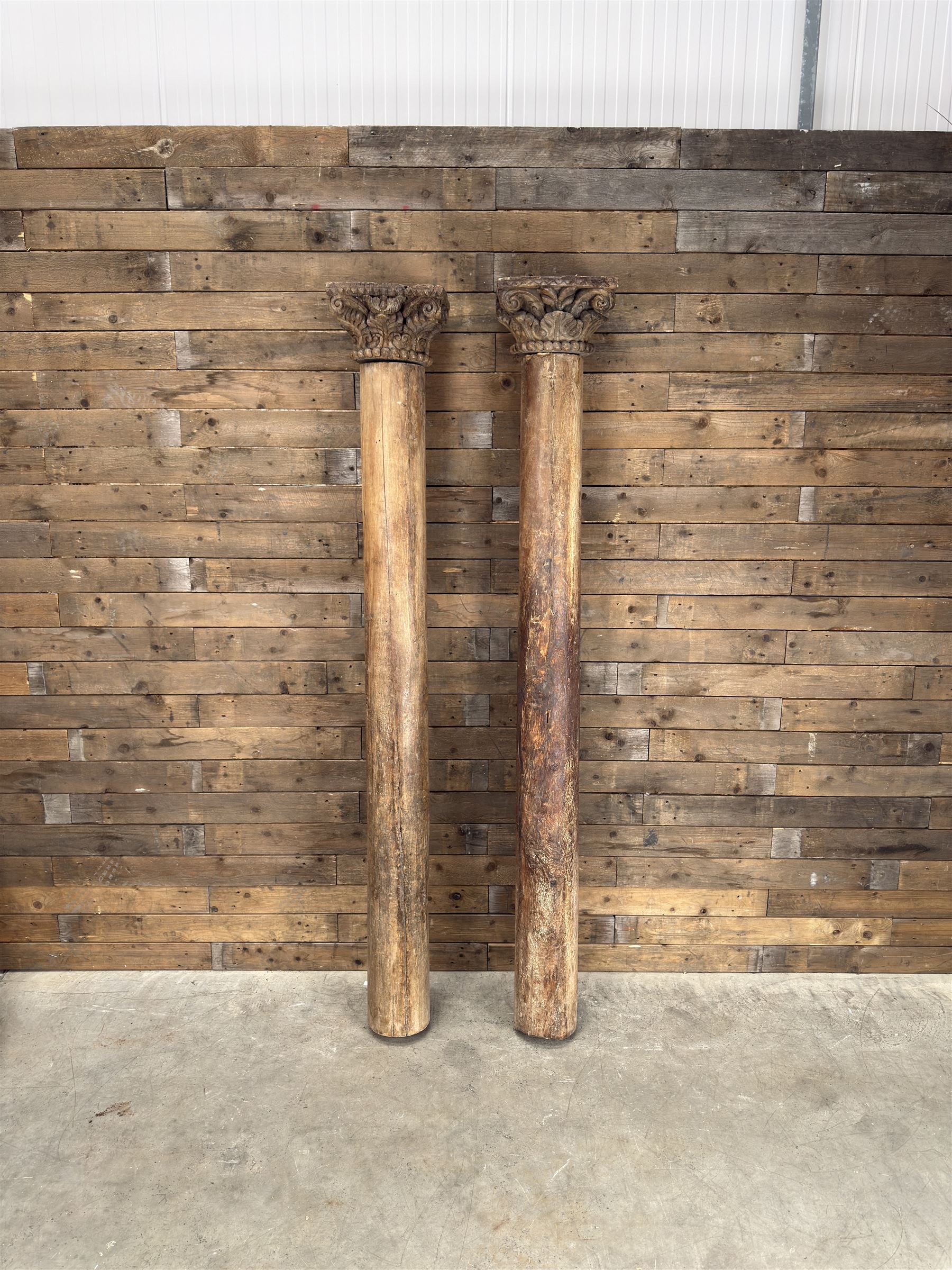 Matched pair of 19th century hardwood architectural columns with carved capitols, column diameter 18cm