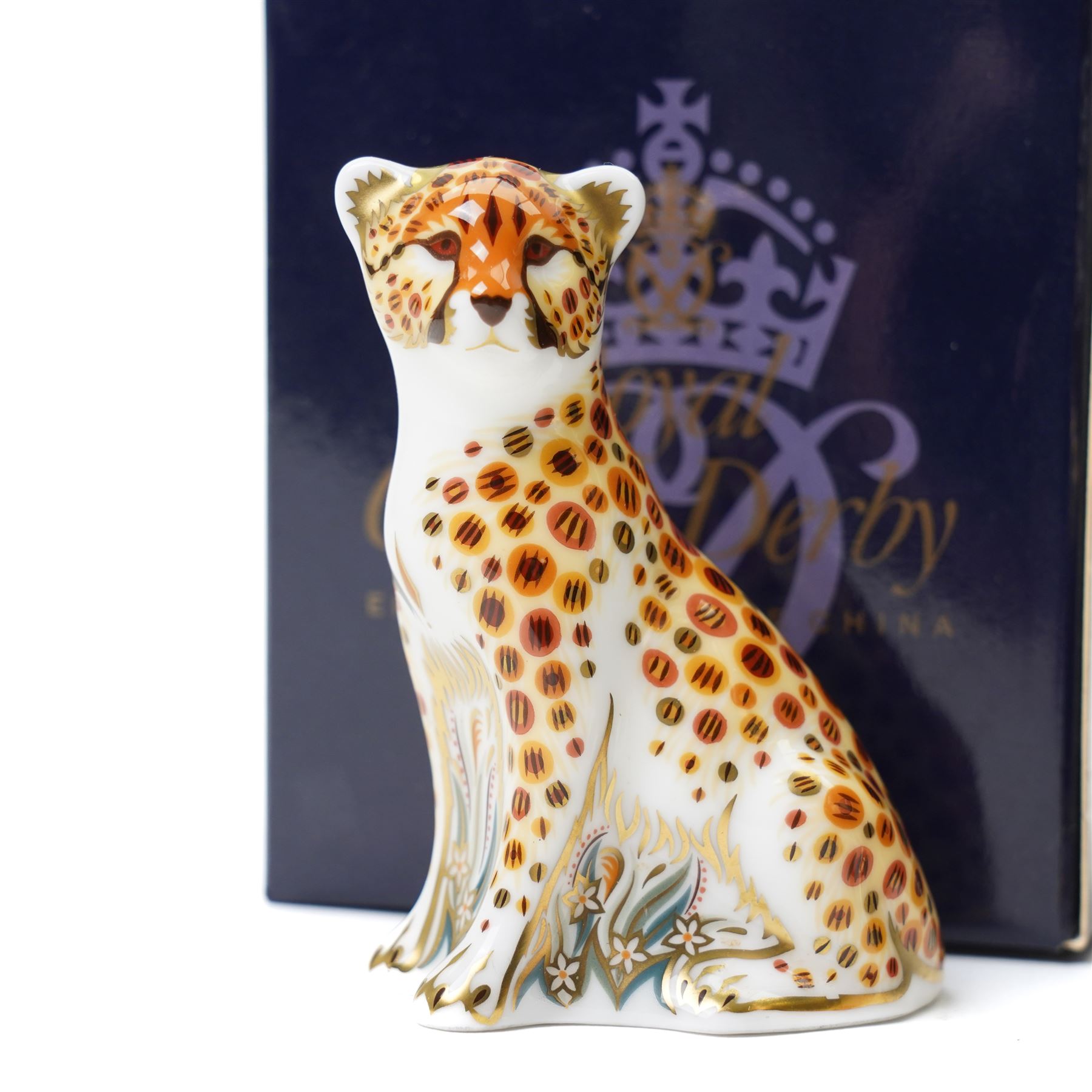 Four Royal Crown Derby paperweights, comprising Meerkat with gold stopper, two Brown Pelicans with gold stoppers, and one Cheetah Cub with gold stopper (4)